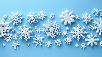 Poster - Snowflakes arranged on a light blue background creating a winter theme with decorative elements for seasonal design and holiday concepts.
