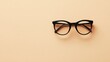© Mulyadi Lim - Stylish Black Eyeglasses on Beige Background