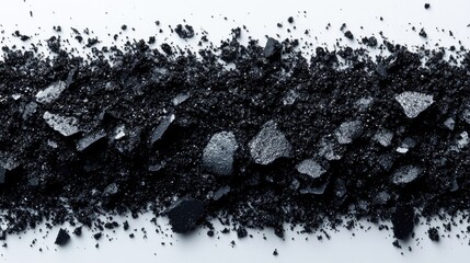 Poster - Black crumbs spread across a white background showcasing texture and contrast with ample space for text or graphic design elements.