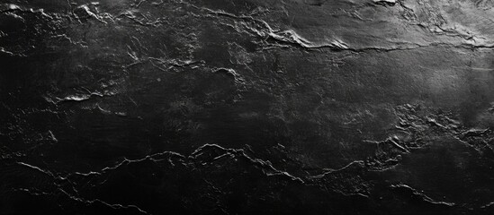 Poster - Dark textured stone surface with natural patterns and subtle highlights