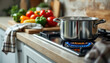 © O - Steaming pot on stove with fresh vegetables in modern kitchen setting