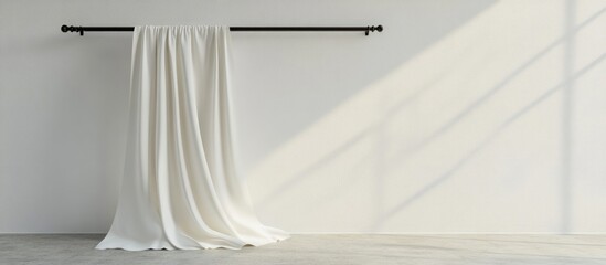 Poster - White linen fabric hanging on a black metal rod in a minimalist room with ample empty wall space for text or design elements
