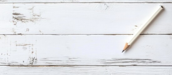 Poster - White pencil on rustic wooden surface with ample negative space for customizable text or creative design use