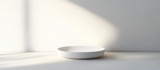 Poster - Minimalist white plate on a light surface with soft shadows and ample space for adding custom text or design elements
