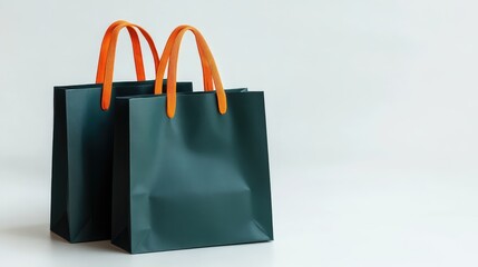 Aufkleber - Dark green gift bags with orange handles arranged on a white background for festive or shopping themes.