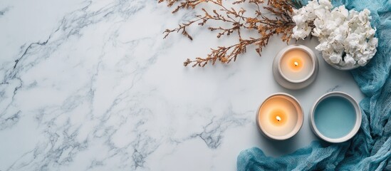 Poster - Elegant white marble texture backdrop with candles and flowers creating a serene atmosphere for text placement or design projects.