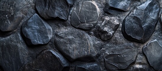 Aufkleber - Dark textured stone wall background with unevenly shaped black rocks, showing natural patterns and shadows, suitable for various design projects. Copy Space