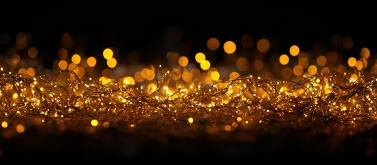 Aufkleber - Warm golden string lights on a dark background creating a bokeh effect with ample Copy Space for text placement.