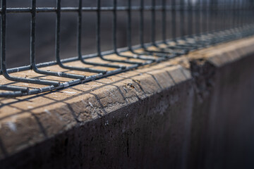 Mesh Fence on Concrete Wall