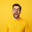 © zetrum - Man in yellow sweater with wide open mouth in surprise or excitement.