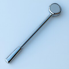 Poster - Clean reflex hammer used in neurological exams isolated on a minimalist background with its rubber head and metallic handle gleaming under soft light