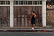 © Sevendeman - Tourist backpacker man crossing street in local Asia old town.