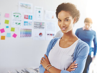 Poster - Arms crossed, documents and portrait of designer woman in office for brainstorming or planning on wall. Confident, creative and smile of social media marketing manager in workplace with statistics