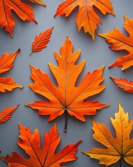 Poster - Bright orange autumn leaves on a light gray background