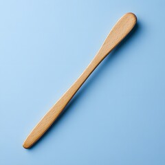 Poster - Tongue depressor isolated on a minimalist background wooden and straight with clean lines showing its utility in medical exams