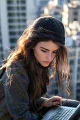 Poster - A woman with long hair is typing away on her laptop