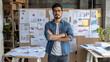 © Number One Studio - confident man stands with crossed arms in modern office space filled with charts and documents. atmosphere reflects productivity and focus