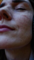 Poster - A peaceful shot of someone wearing large, over-ear headphones, gazing up at the last light filtering through a lush canopy of branches.