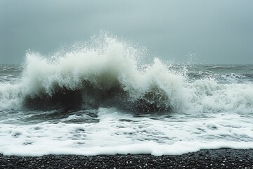 Aufkleber - Powerful ocean waves crash dramatically against the rocky shore on a cloudy day