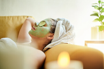 facial, relax and woman with cucumber on eyes or face for vitamin c, wellness and natural beauty lyi