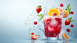 © Nadiyah - Refreshing summer fruit cocktail splash;  ice, raspberries, strawberries, peach, mint; blue background; ideal for beverage ads