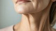 © Sawyer0 - A detailed close-up of a mature woman's neck, focusing on skin wrinkles and texture, reflecting wisdom and the beauty of aging gracefully.