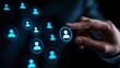 © Dounonji - A hand points at digital user icons, representing networking and connections in a futuristic or tech-driven environment.