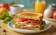 © Altaf - Toast sandwich with gouda cheese and turkey ham filled with tomato and lettuce on a bright background with ingredients in blurry background. Served with coffee and orange juice and eggs