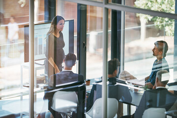 Wall Mural - Pregnant woman, presentation and boardroom by team, talk or smile for feedback with project in office. Speaker, men and women with group at meeting for stats, review or charts for brand communication