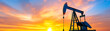 © Fareedoh - Oil pump silhouette at sunset scenery.