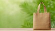 © niramol - Gold Tote Bag on Wooden Table Against Green Background