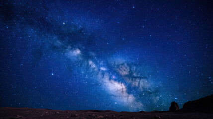 Wall Mural - starry night sky, vast expanses filled with twinkling stars, deep dark blue backdrop, celestial wond