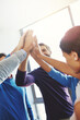 © peopleimages.com - Employees, business team and high five in office, huddle and collaboration with creative people. Group, circle and solidarity with achievement in workplace, journalism and motivation at news agency