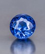 Vibrant Blue Sapphire Gemstone with Facets, Close-up Studio Shot