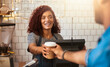 © peopleimages.com - Cafe, customer and woman with takeaway cup for latte, bakery and small business. Entrepreneur, barista and cafeteria with person and drinks in coffee shop for restaurant, waitress and lens flare