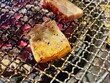 © Leiter1940s - Grilled bacons slice on metal mesh for grill