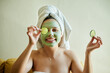 © peopleimages.com - Facial, beauty and woman with cucumber on eyes or face for vitamin c, wellness and natural treatment relax in a home. Relax, spa and portrait of happy female using vegetable for detox or dermatology