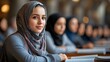 © Юлия Гриб - Young Woman Studying in a Library With Peers, Engaged in Education and Learning Discussion in an Academic Setting