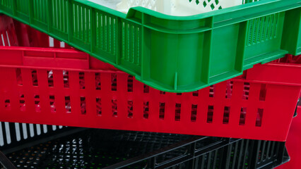 Aufkleber - A stack of plastic containers with different colors and sizes. Concept of organization and variety, as the containers come in different shapes and sizes