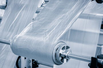 Poster - Industrial machine for production and printing of polyethylene bags. Industrial concept background