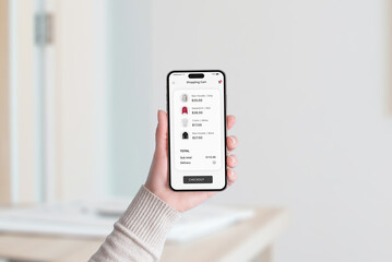 Smartphone screen showing a shopping cart filled with clothing items, total price, and a 'Checkout' button at the bottom in a modern app