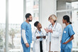 © peopleimages.com - Healthcare, meeting and doctor with tablet for online patient report, results review and diagnosis. Training, medical people and team communication in hospital, clinic or health facility schedule