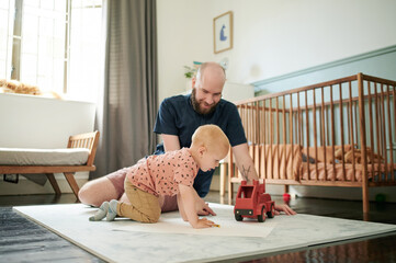 Sticker - Father, baby and playing with truck toy in family home or bedroom floor carpet. Man and happy boy, child or kid together to play for growth development, learning and care or quality time with parent