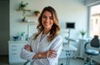 © miss irine - Confident female dentist smiles warmly. Stands in modern clinic. Wears white coat. Friendly pro ready for patient care. Modern clinic interior. Expert health care practitioner. Focus on modern dental