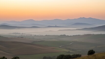 Sticker - Rolling Hills and Misty Valleys at Sunrise