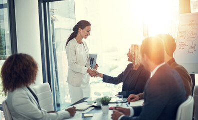 Poster - Handshake, contract and deal with business people in meeting for merger success, acquisition and thank you. Teamwork, loan agreement and banking firm with employees in office with lens flare