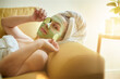 © peopleimages.com - Spa, relax and portrait of woman with cucumber on an eye or face for vitamin c, wellness and natural beauty lying on a couch or sofa. Treatment, spa and skincare of female using vegetable to detox