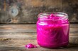 © Phetthanousack - Fuchsia slime in a jar with a dirty background, sticky mess, arts and crafts, bright hue