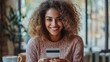 © Astri - Smiling Woman Using Credit Card Online Shopping