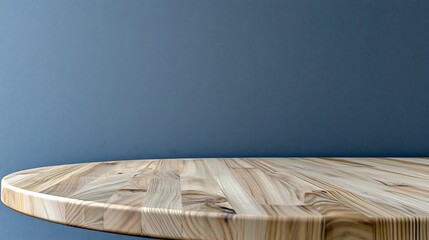 Sticker - Smooth wooden tabletop with natural grain against a minimalist blue wall, ideal for product display